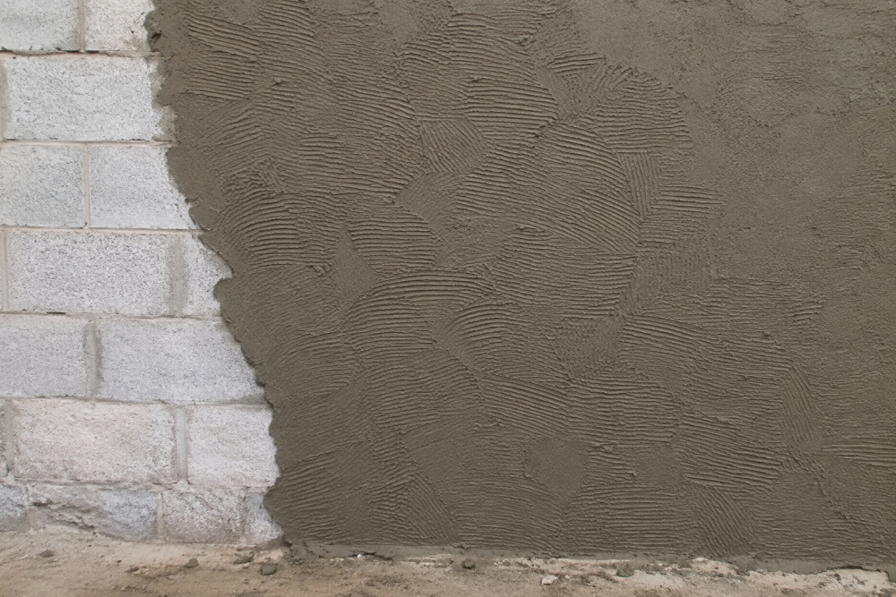 bonding plaster applied to a brick block